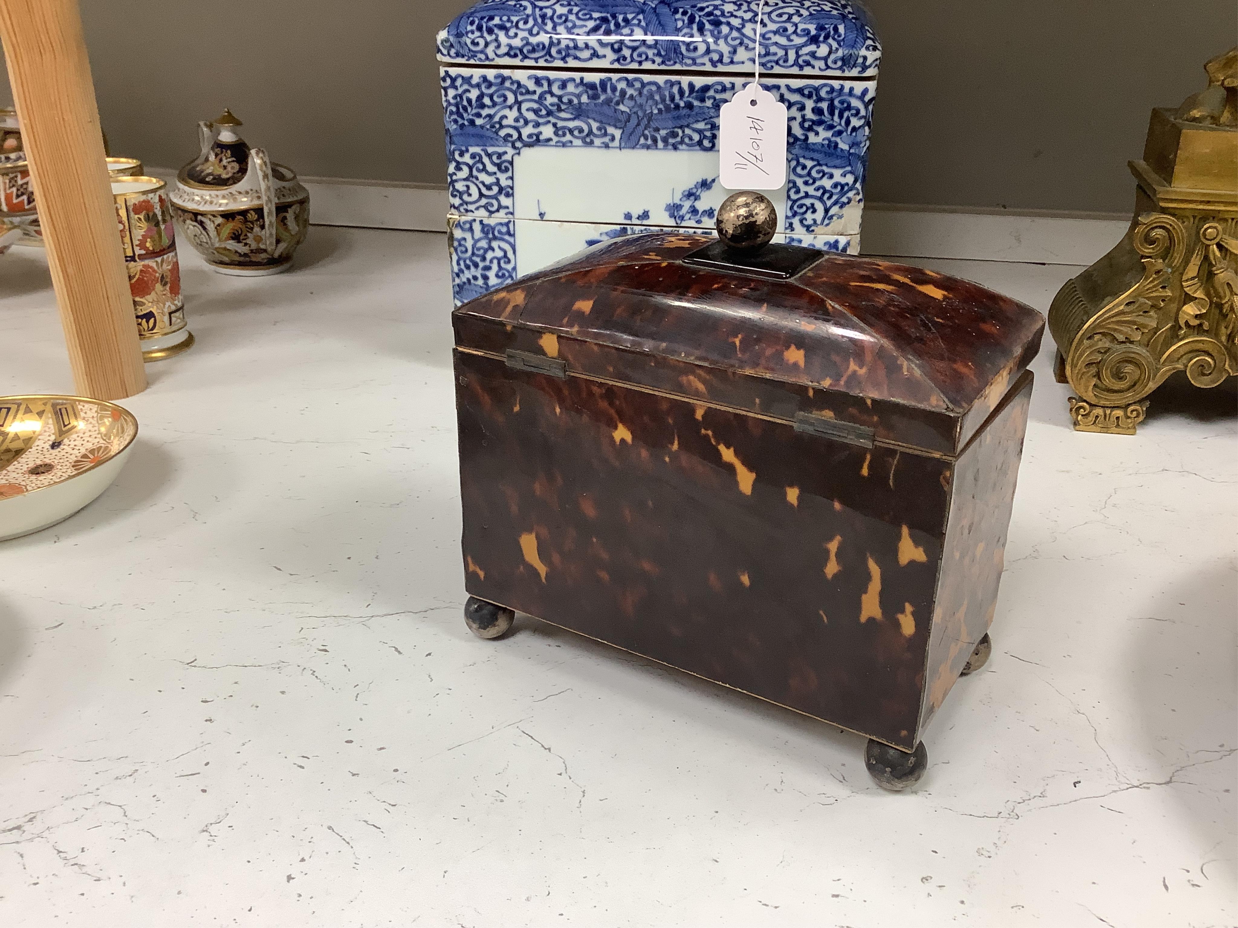 A Regency tortoiseshell tea caddy, with fluted paterae bowfront, 17cm high, 18cm wide, 10cm deep